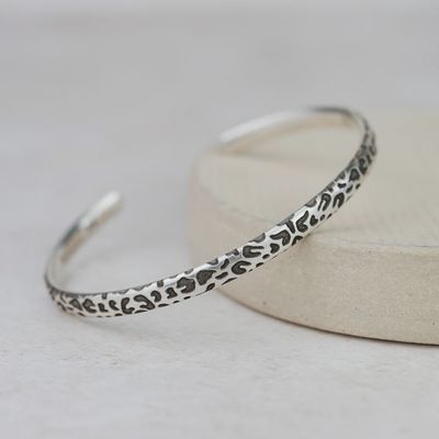 Textured cuff with leopard print pattern