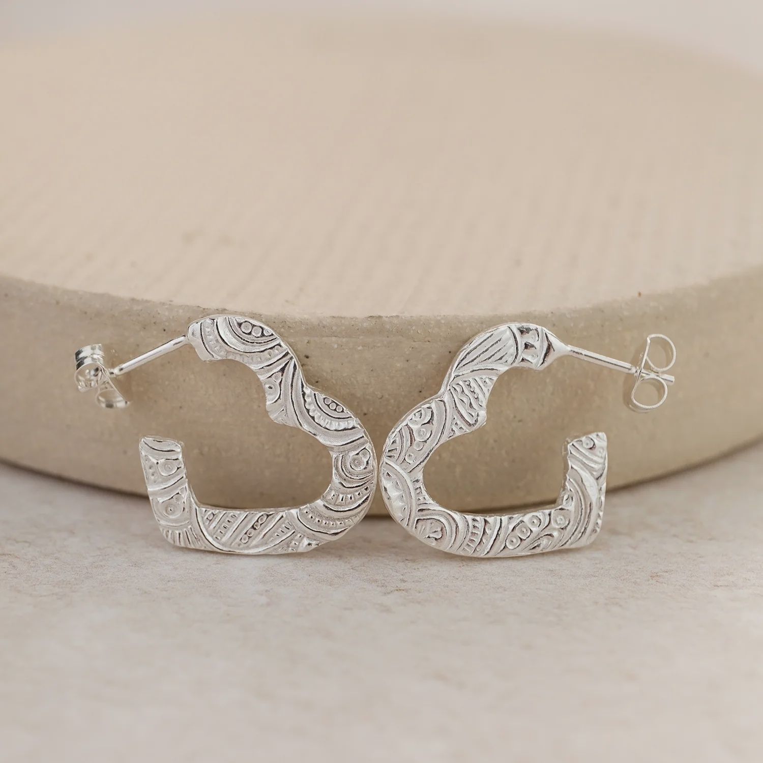 Textured cut out heart earrings