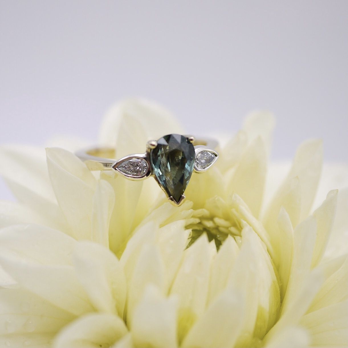 Pear-shaped teal sapphire and diamond ring