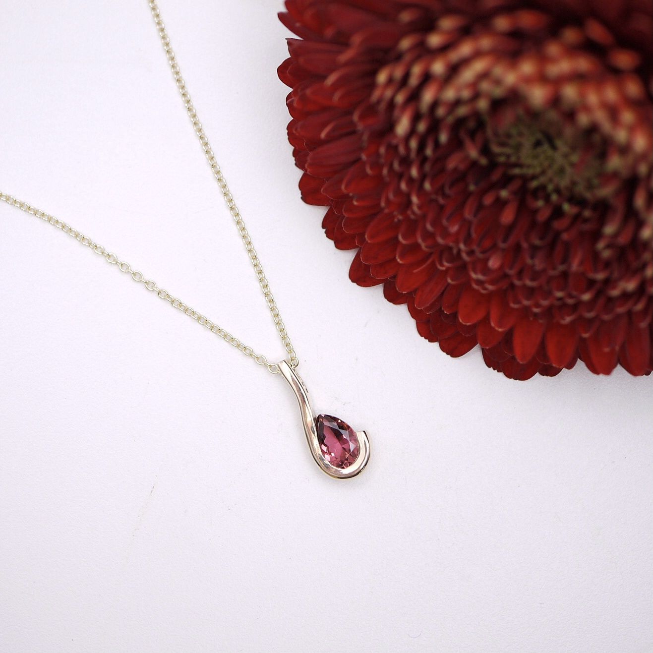 Pink tourmaline wave pendant in gold