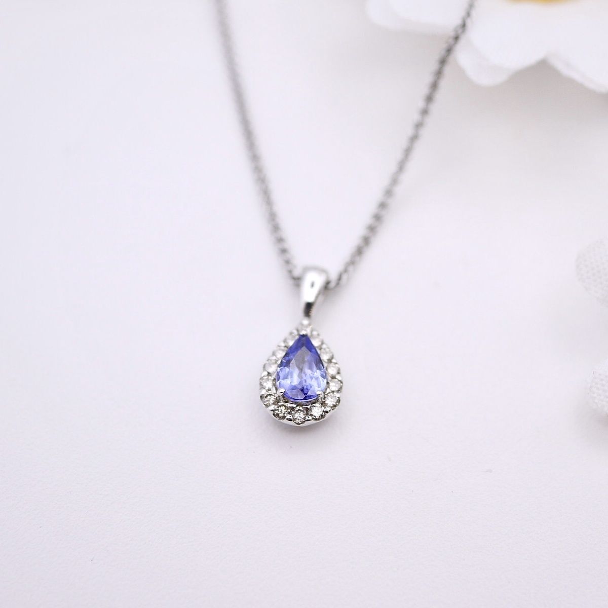 Tanzanite pendant with diamond halo