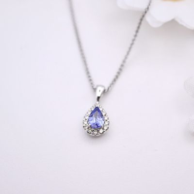 Tanzanite pendant with diamond halo