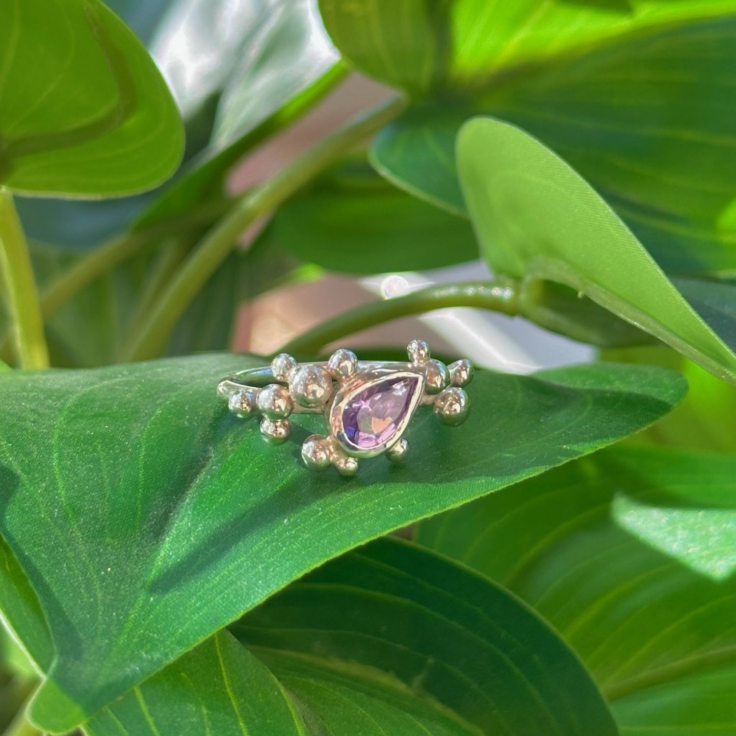 Pear-shaped amethyst &#39;nebula&#39; ring