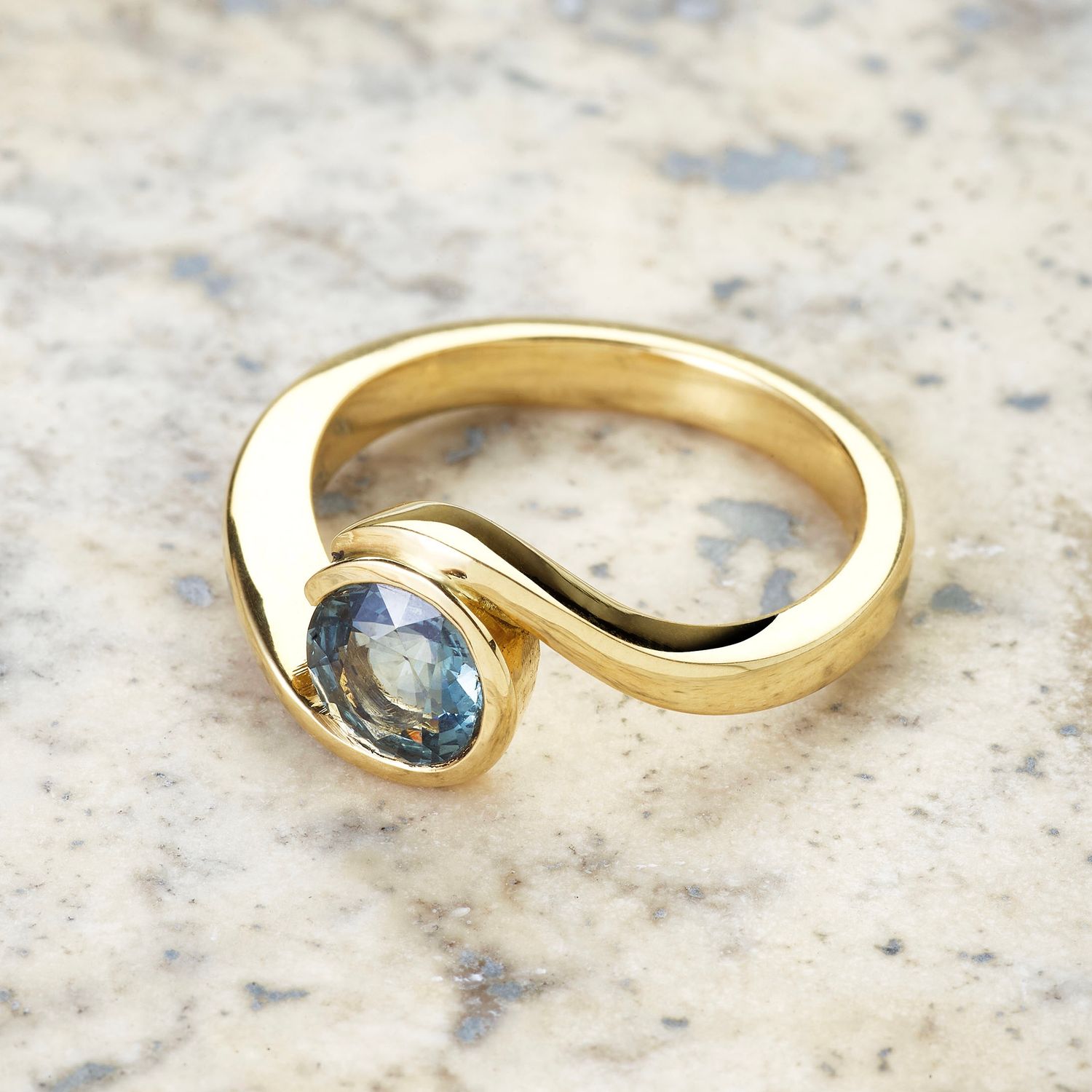 Teal sapphire wave ring