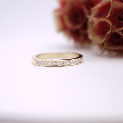 Diamond half eternity ring in gold