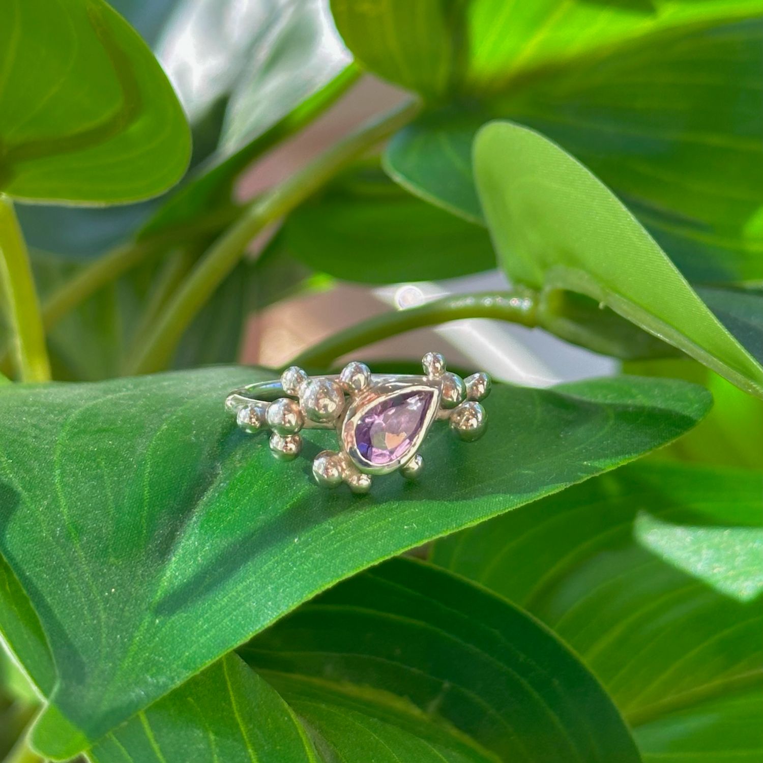 Pear-shaped amethyst 'nebula' ring