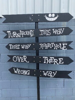 Signage; Alice in wonderland directional sign