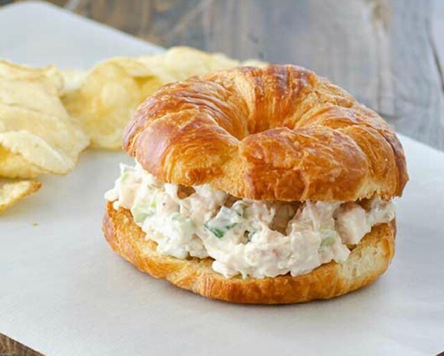 Chicken salad with lettuce, tomato, and onion