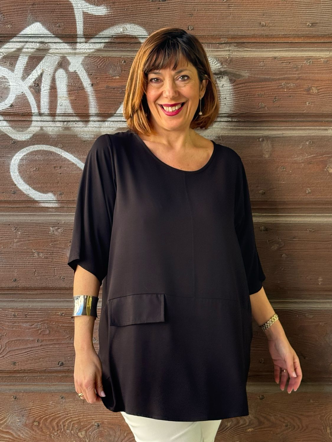 Blusa fluida taschino