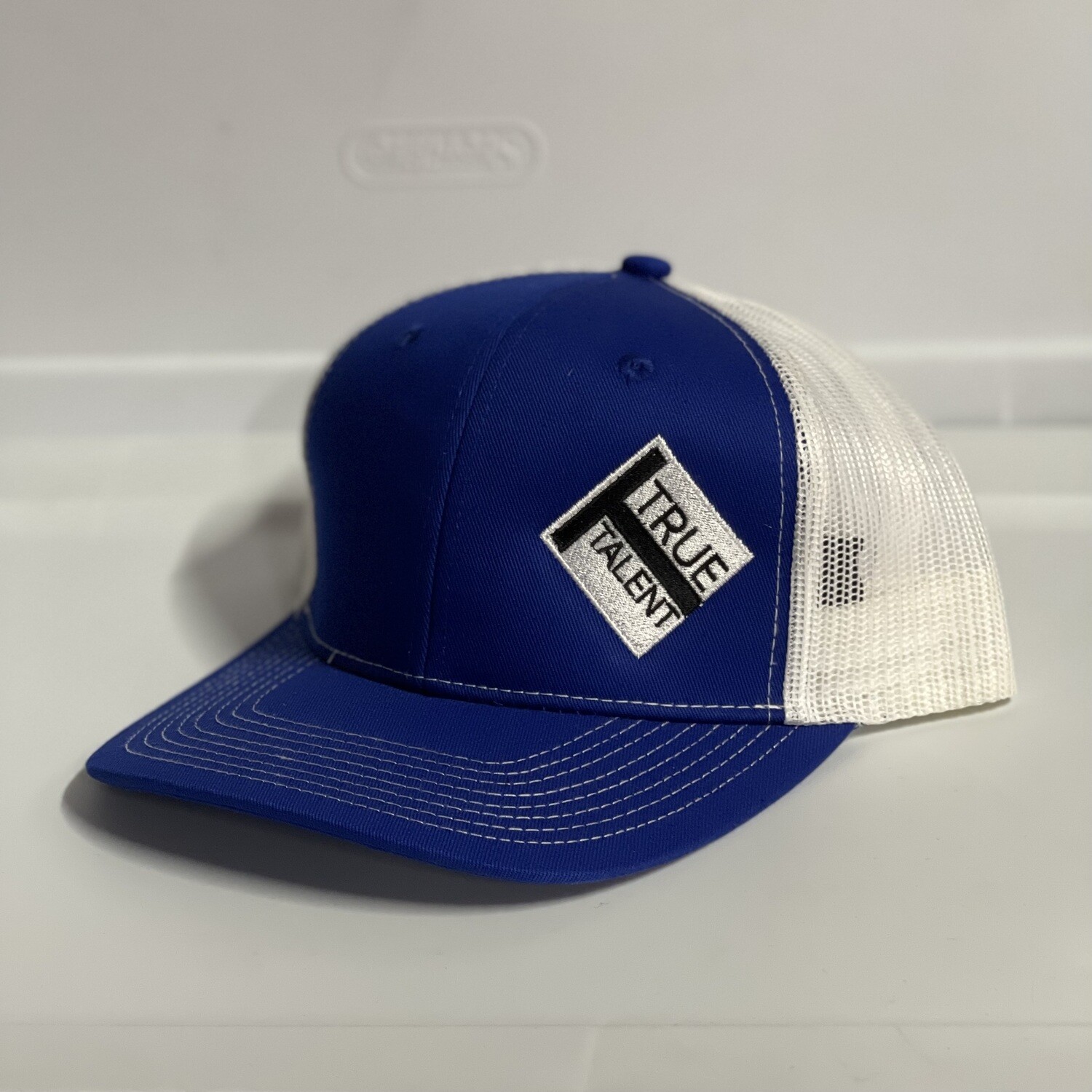 Blue/White Trucker Hat with True Talent Logo