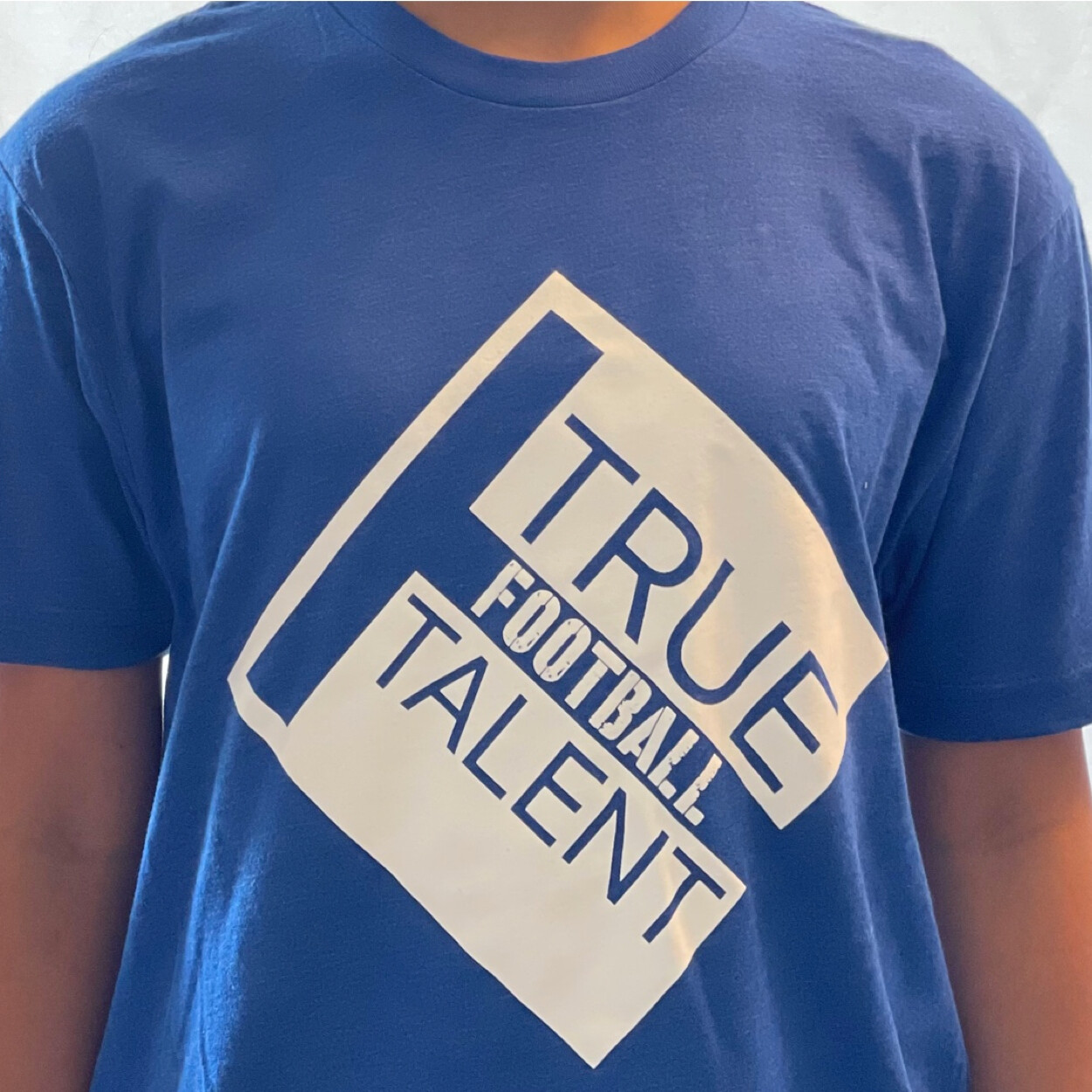 Football Next Level Tee Shirt, Blue with White Logo