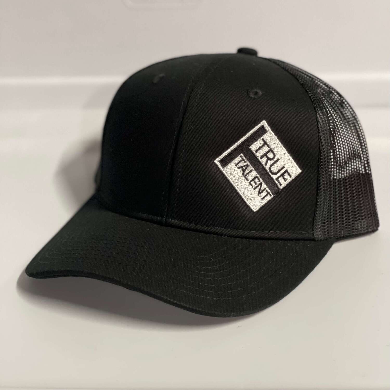 Black Trucker Hat with True Talent Logo