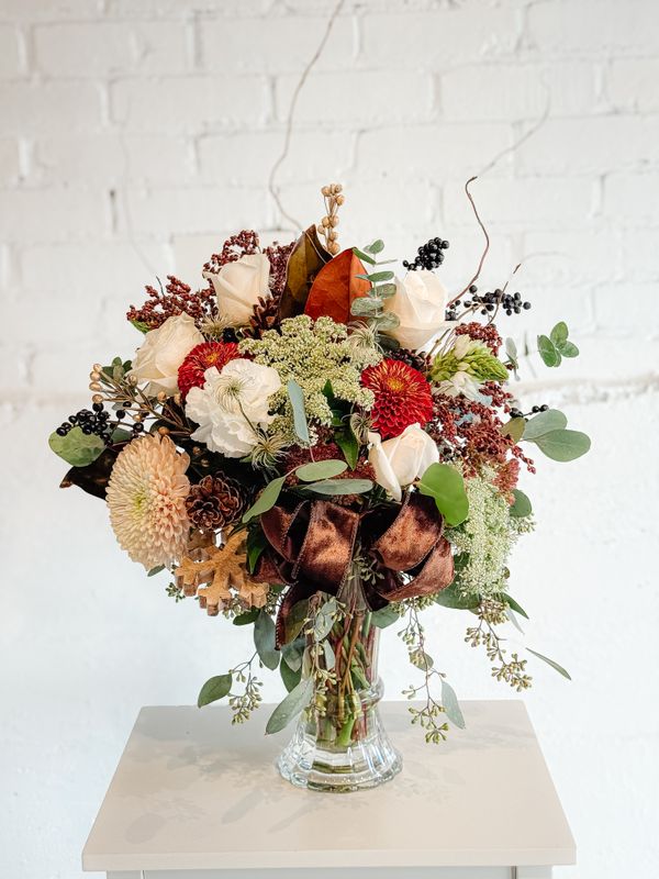 Hearth &amp; Home rustic seasonal floral centrepiece with cream flowers, copper accents and greenery