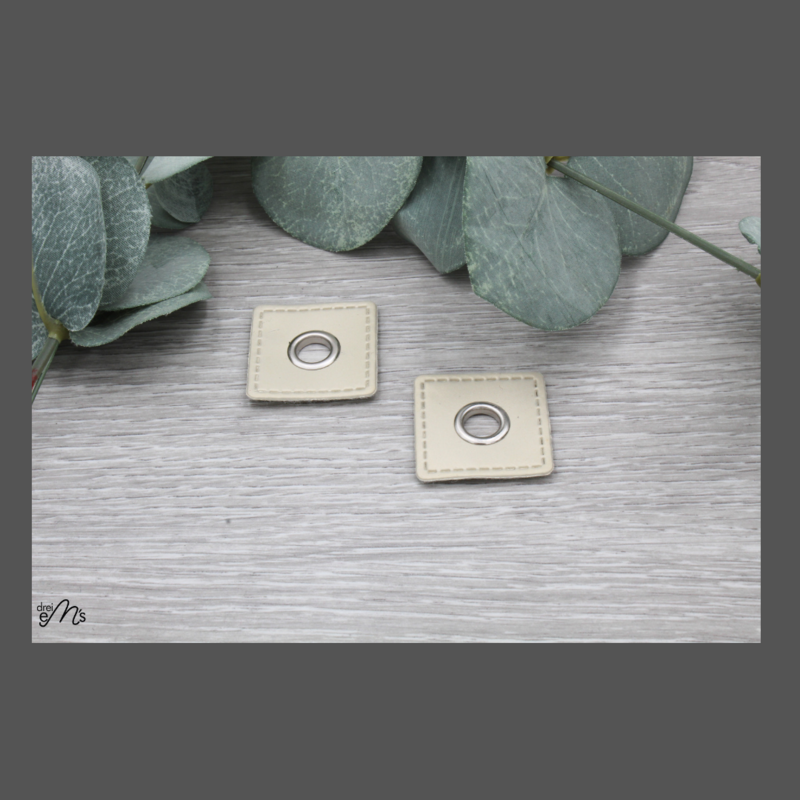 2 Stk Ösen Nickel auf Kunstleder creme 2 Stk Ösen Nickel auf Kunstleder creme