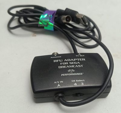 NELA-0, Sega Dreamcast Cable Adaptador RFU (Radio Frequency Unit)