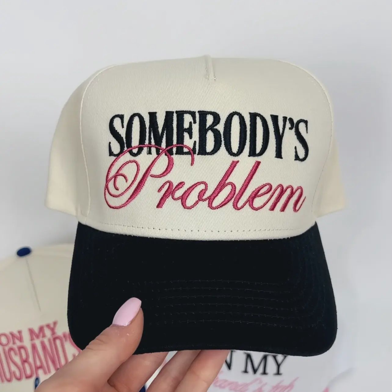 SOMEBODY&#39;S PROBLEM TRUCKER HAT
