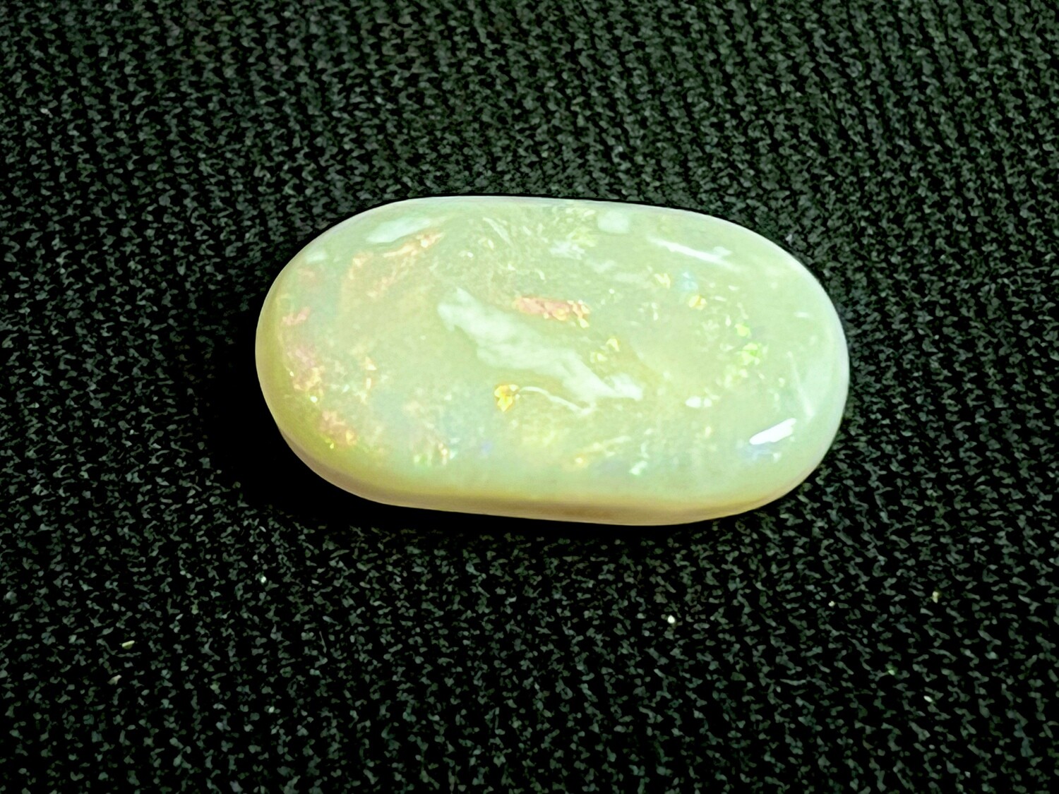 White opal with red, green and blue colours