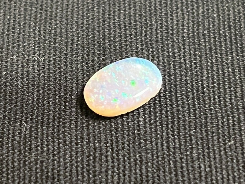Bright crystal opal with green and blue