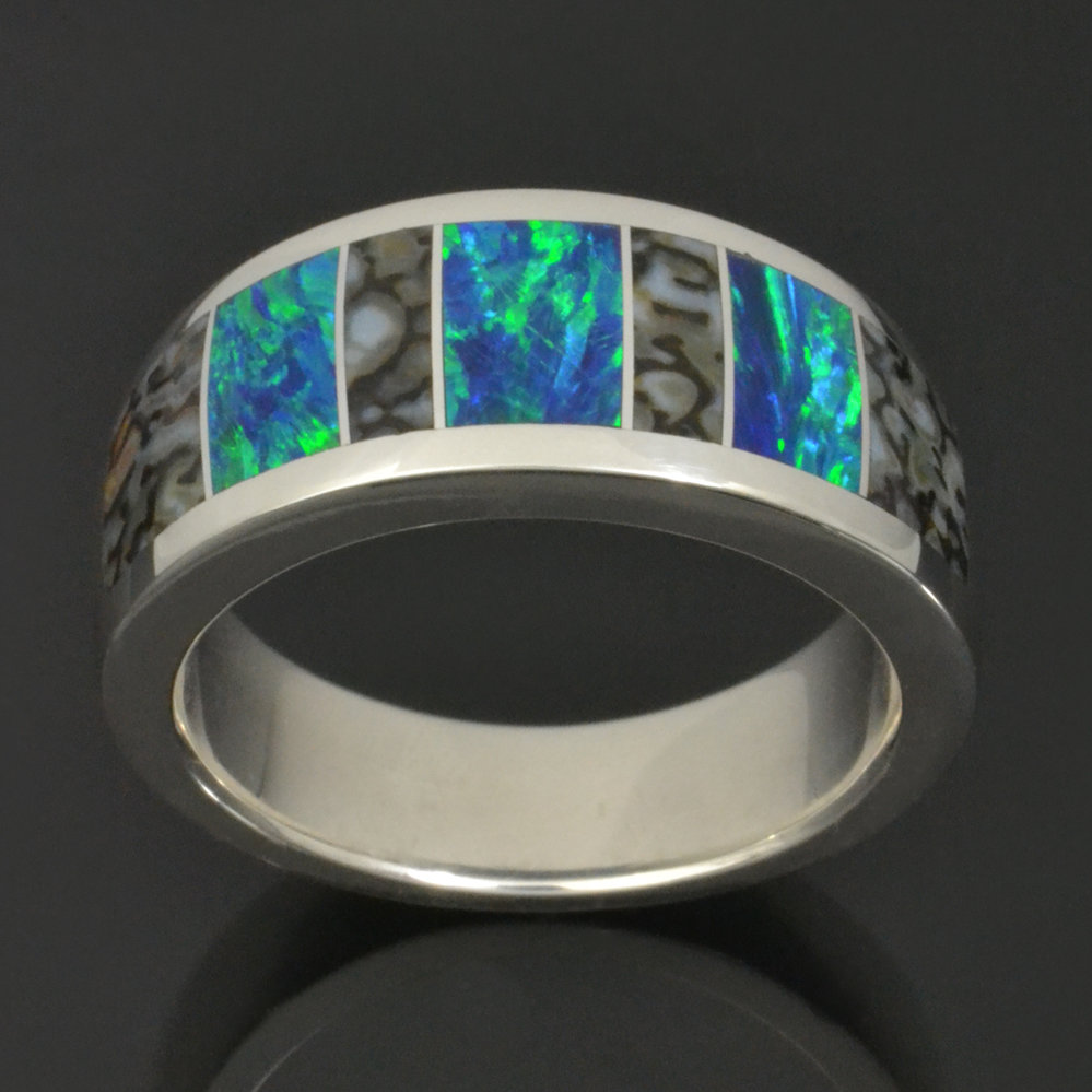 Dinosaur bone wedding ring with lab created opal in sterling silver.
