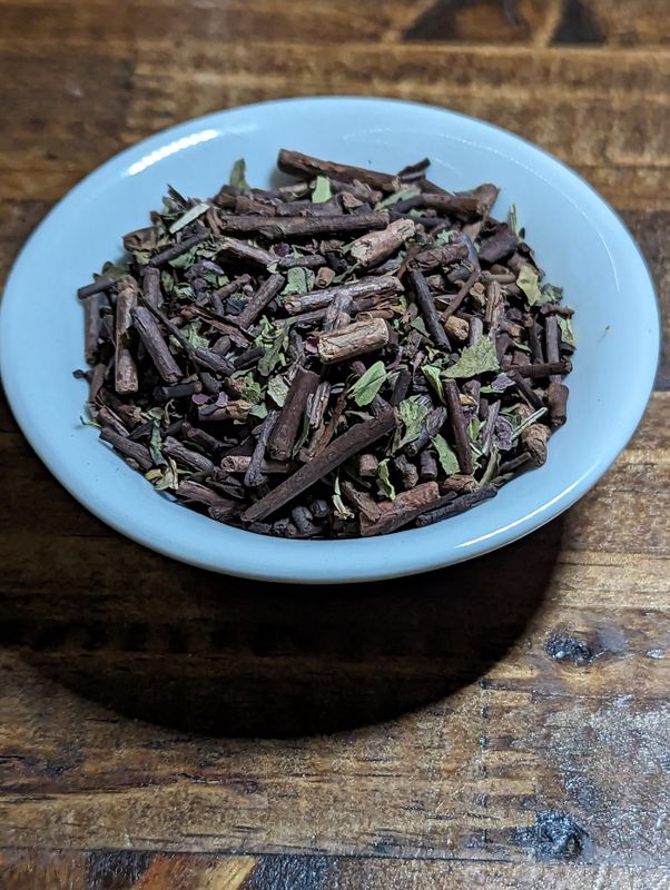 A small white bowl of a blend of roasted green tea, peppermint, and seaweed.