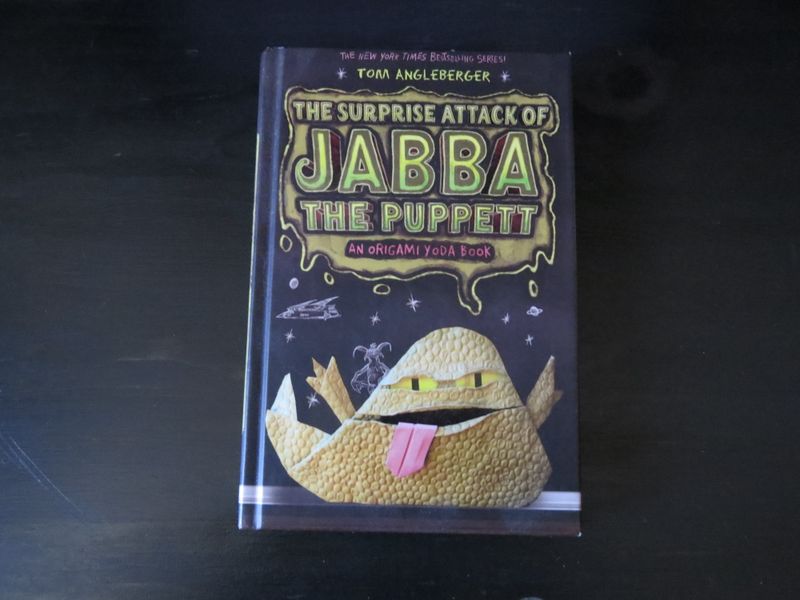 A picture of a hardcover copy of "The Surprise Attack of Jabba the Puppet" by Tom Angleberger.