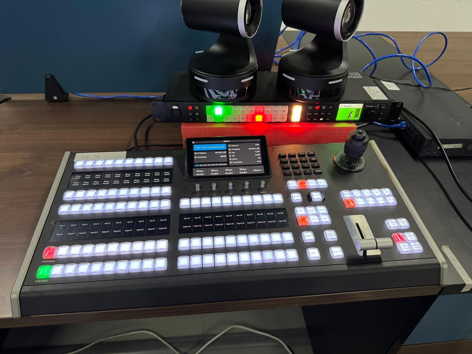 Advanced professional control panel compatible with ATEM, vMix, and OBS Studio, featuring built-in PTZ camera control and an expanded set of illuminated buttons. Designed for demanding live production environments, it offers a compact yet powerful layout with intuitive operation. Ideal for technical directors and content creators who need precise switching, PTZ camera movements, and full control over complex video workflows. Seamlessly integrates with multicam switchers and streaming platforms, providing reliable connectivity for professional AV productions.