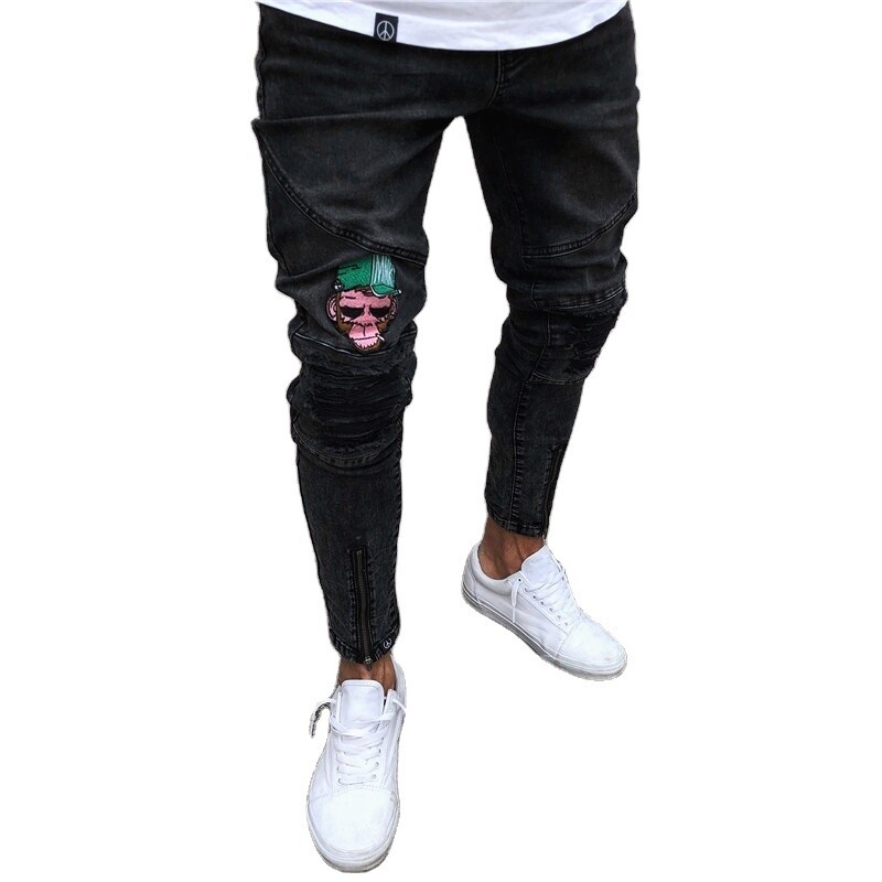 Distressed skinny jeans with an embroidered monkey, perfect for a night out on the town.