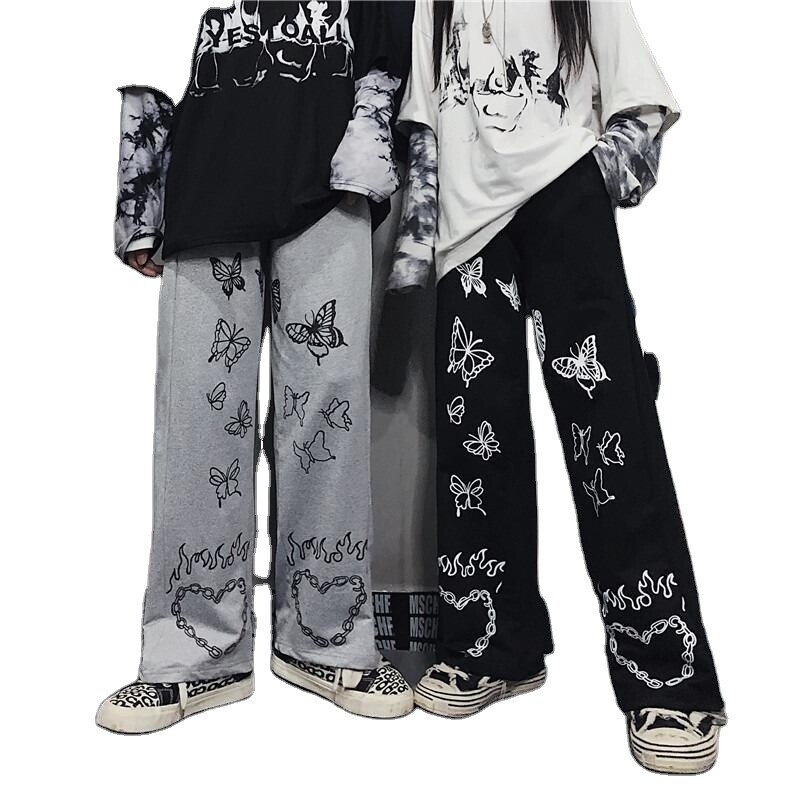 Wide-legged, high-waisted, butterfly-print pants for men.
