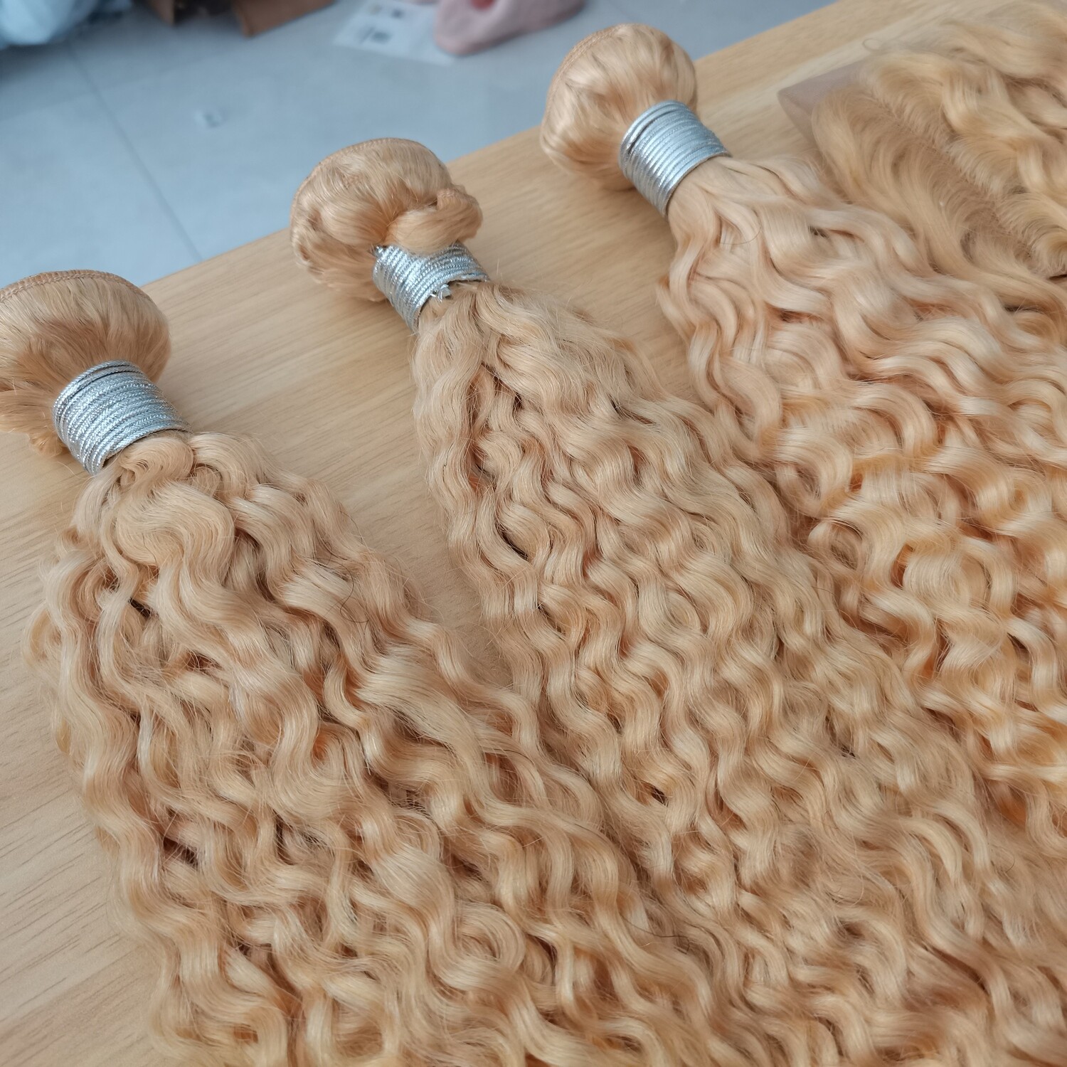 Best grade 613 blonde human hair curly hair bundles, 10 inches to 40 inches, $100 to $590.