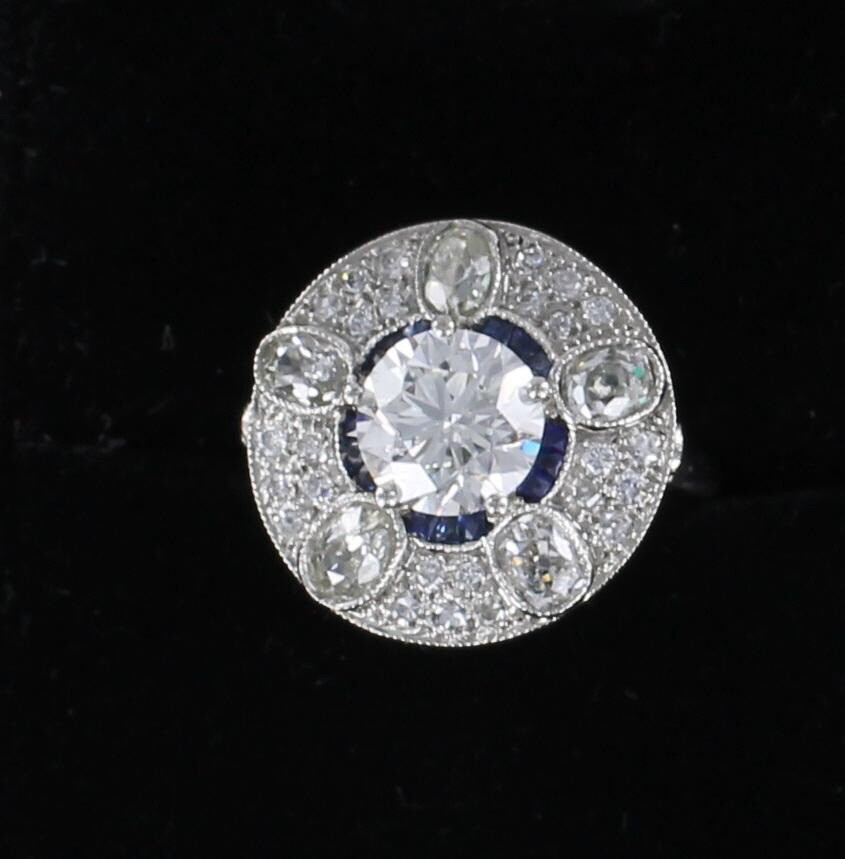 PLATINUM GIA CERTIFIED 2.02 CT ROUND BRILLIANT DIAMOND WITH SAPPHIRE AND OVAL DIAMOND RING