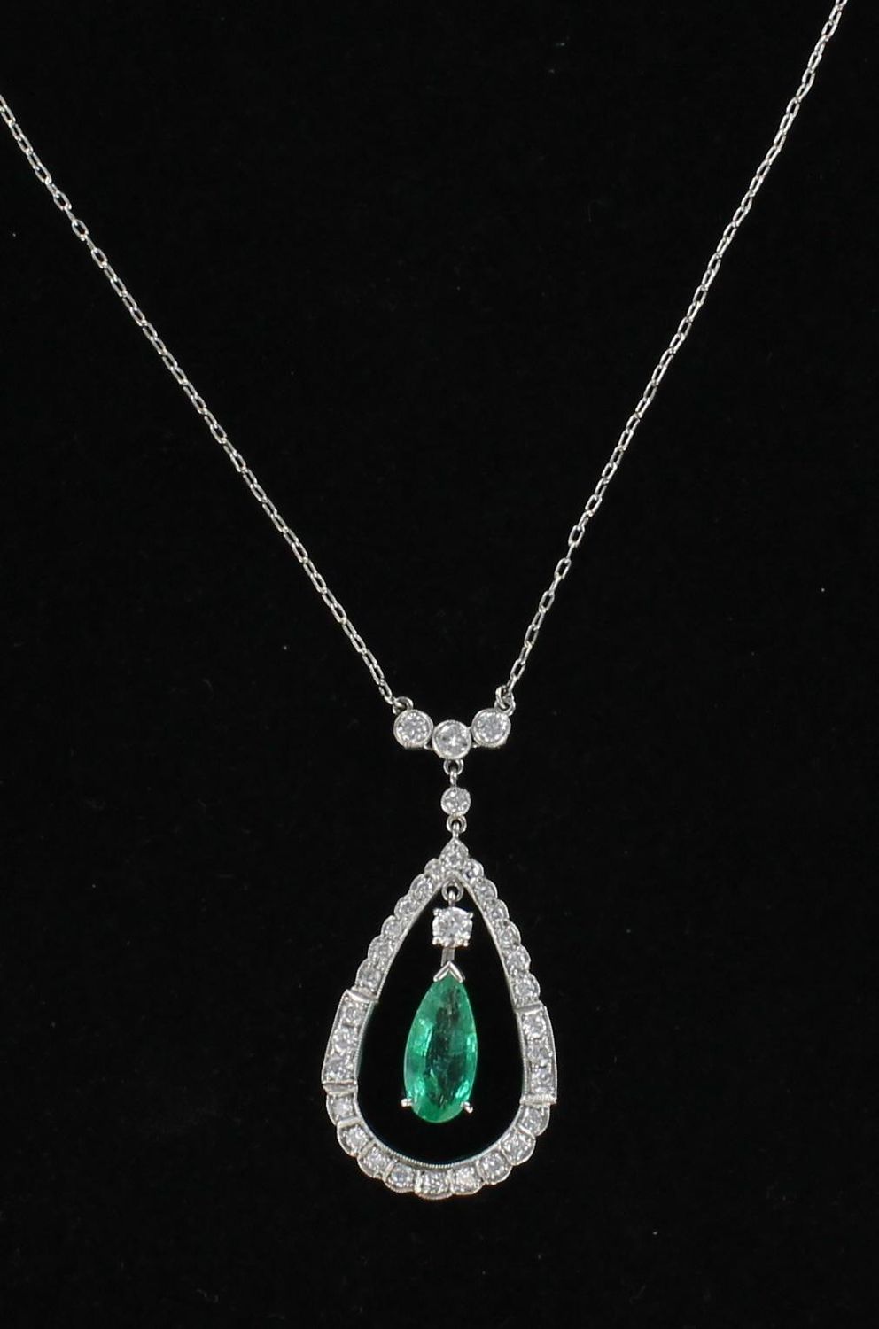 PLATINUM EMERALD AND DIAMOND PENDANT