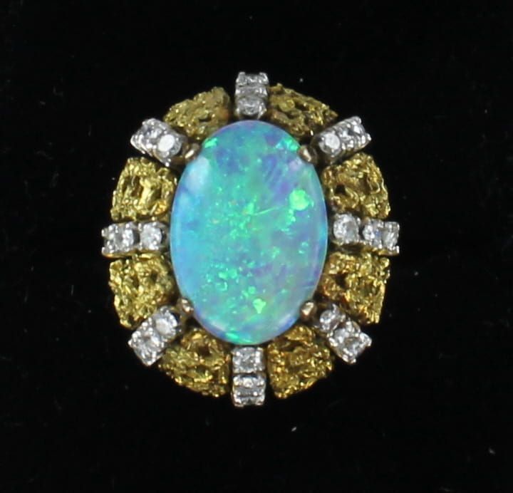 18KTY BLACK OPAL WITH 1.0 CT TW DIAMOND RING
