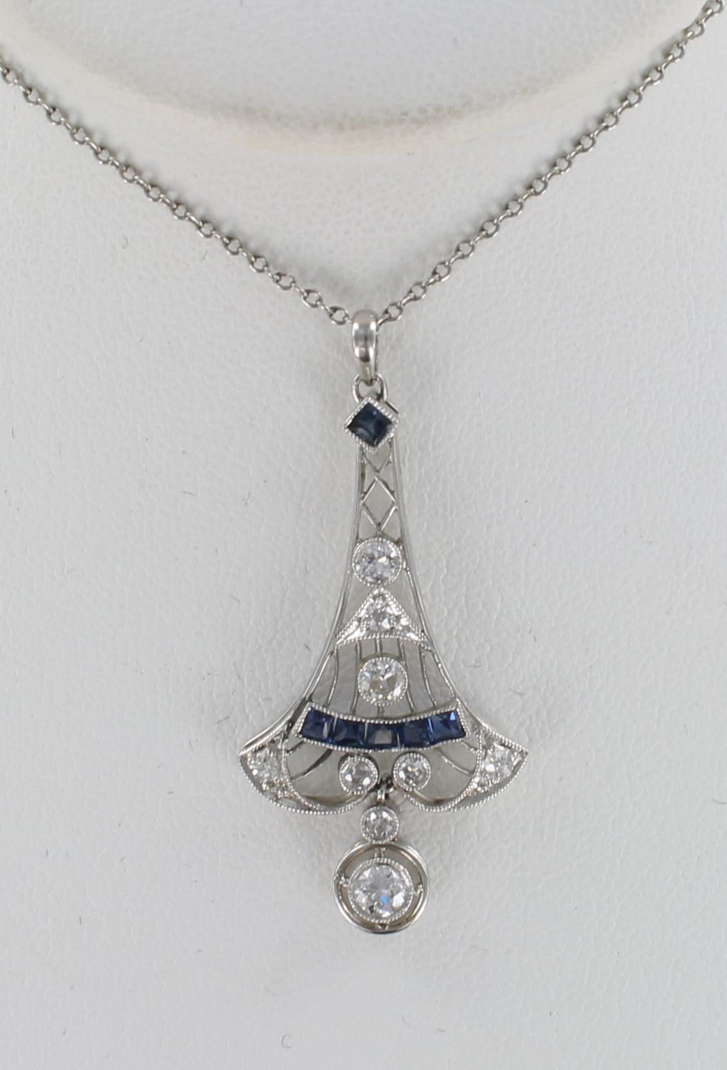 PLATINUM ART DECO .70 CT TW DIAMOND WITH SAPPHIRE PENDANT. CA 1920&#39;S