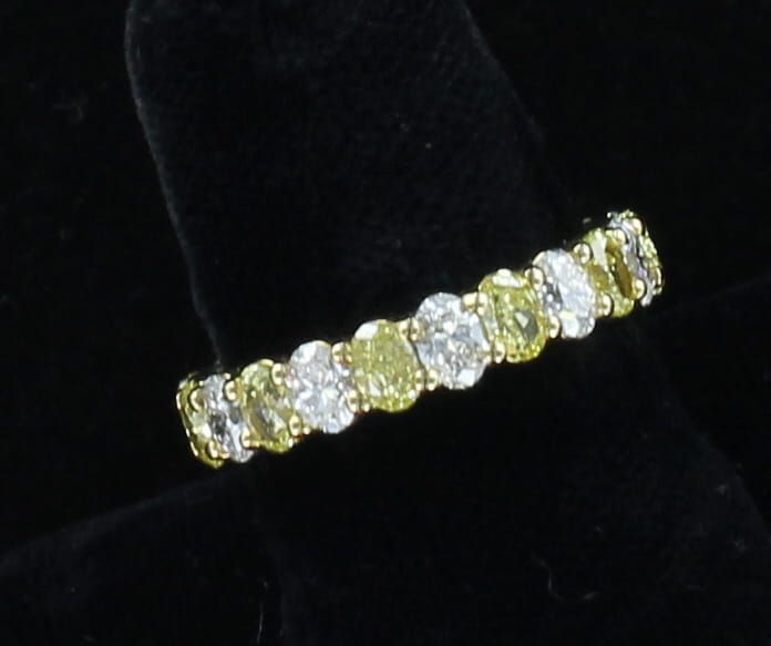 18KT 3.26 CT TW WHITE AND FANCY YELLOW OVAL BRILLIANT ETERNITY BAND, SZ 6