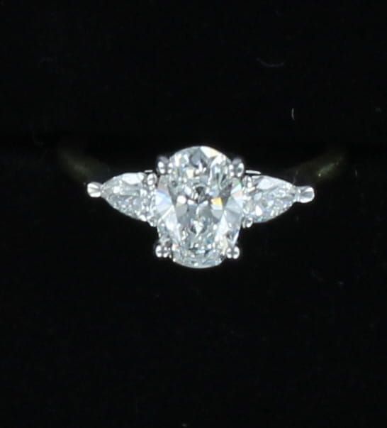 14KT/T 1.12 CT OVAL BRILLIANT DIAMOND WITH 2 PEAR SHAPED DIAMONDS .36 CT TW ENGAGEMENT RING