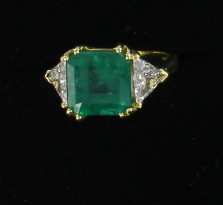 18KTY 4.7 CT EMERALD WITH 1.5 CT TW TRILLIONS RING