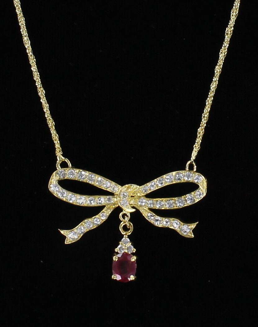 18KT DIAMOND AND RUBY BOW NECKLACE