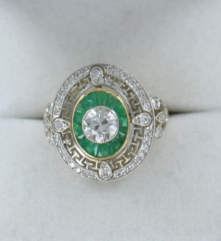 PLATINUM/14KTY DIAMOND WITH EMERALD RING