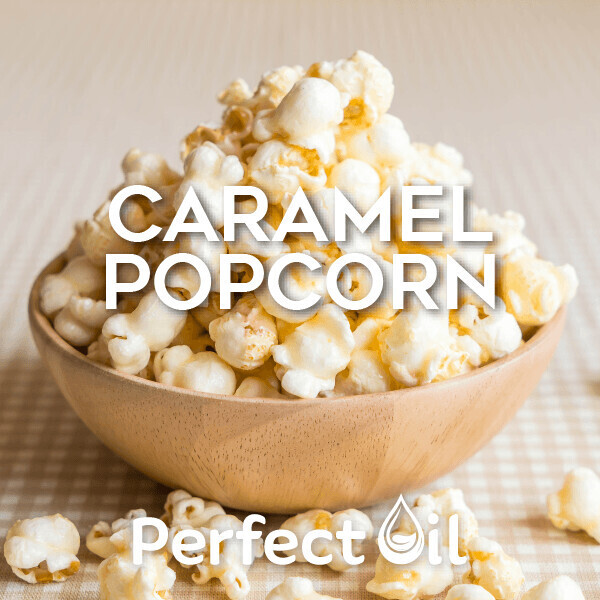 Picture of a wooden bowl of caramel popcorn with a few pieces on the tan and white checkered tablecloth under the bowl with caramel popcorn and perfect oil on top of the image.