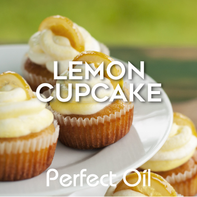 Picture showing a shiny white plate with three iced lemon cupcakes above two more iced lemon cupcakes with a green grassy background with the words lemon cupcake and Perfect Oil in white on top of the image itself. 