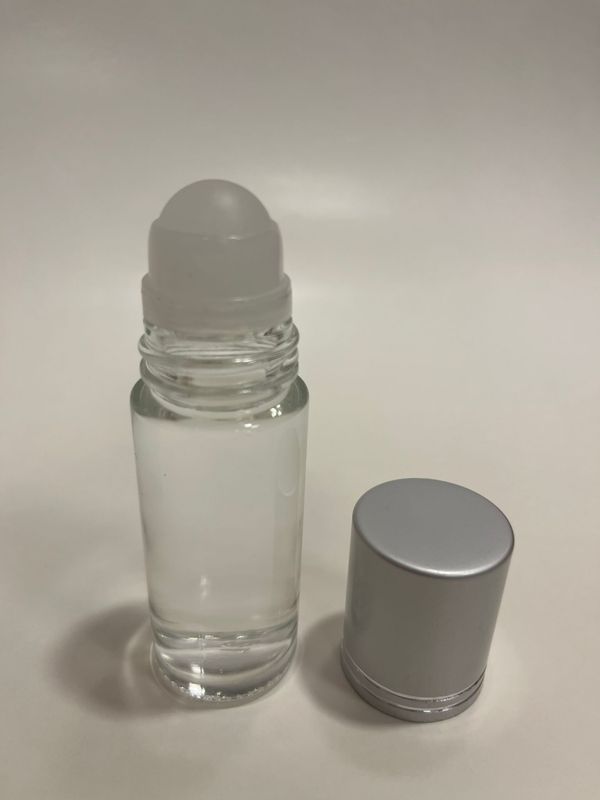 Picture of a clear glass roll-on bottle and a shiny silver cap.
