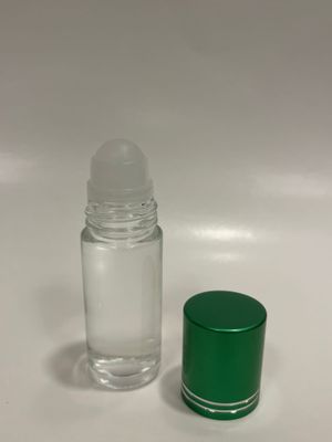 Picture of a clear glass roll-on bottle and a shiny green cap.