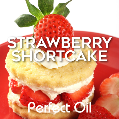 Picture showing a strawberry shortcake with a strawberry on top and a few to the right on a red plate with the words strawberry shortcake and Perfect Oil in white on top of the image itself. 