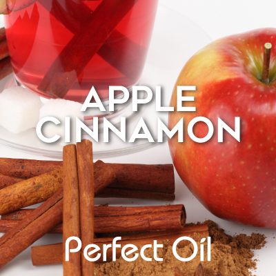 Picture showing an apple with several cinnamons sticks and a glass cup of tea with sugar cubes on a glass plate with the words apple cinnamon and Perfect Oil in white on top of the picture. 