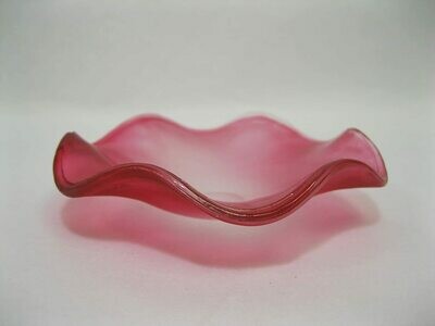 Picture of a frosted red wavy glass replacement bowl for an aroma lamp. 