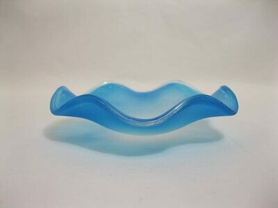 Picture of a frosted blue wavy glass replacement bowl for an aroma night light. 
