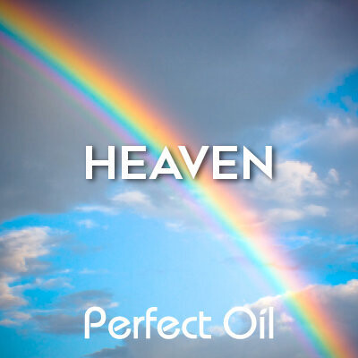 Picture showing a rainbow climbing from the lower right corner of the picture to the upper left across a cloudy blue sky with the words heaven and Perfect Oil in white on top of the image itself. 
