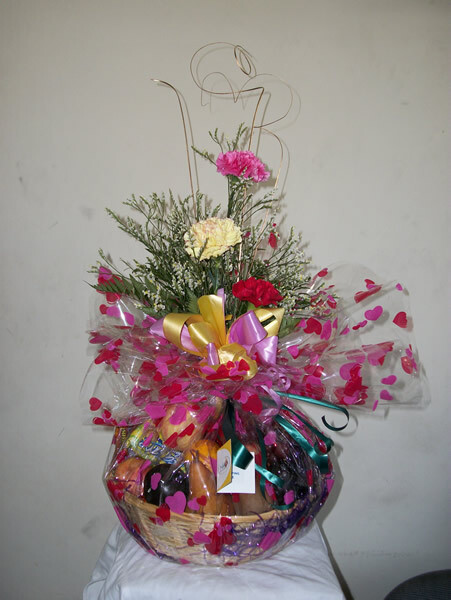 Fruit basket with 3 Carnations in a Vase