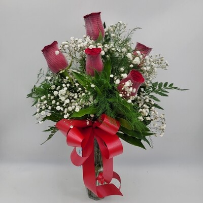 5 roses in a vase