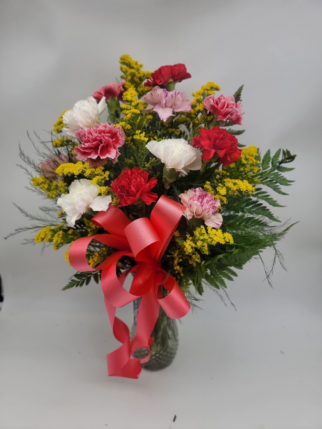 12 Mix colour carnations in a vase